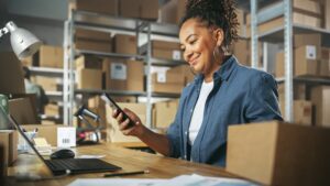 - BMA Payroll A small business owner confidently reviewing payroll reports, symbolizing hassle-free payroll tax management.