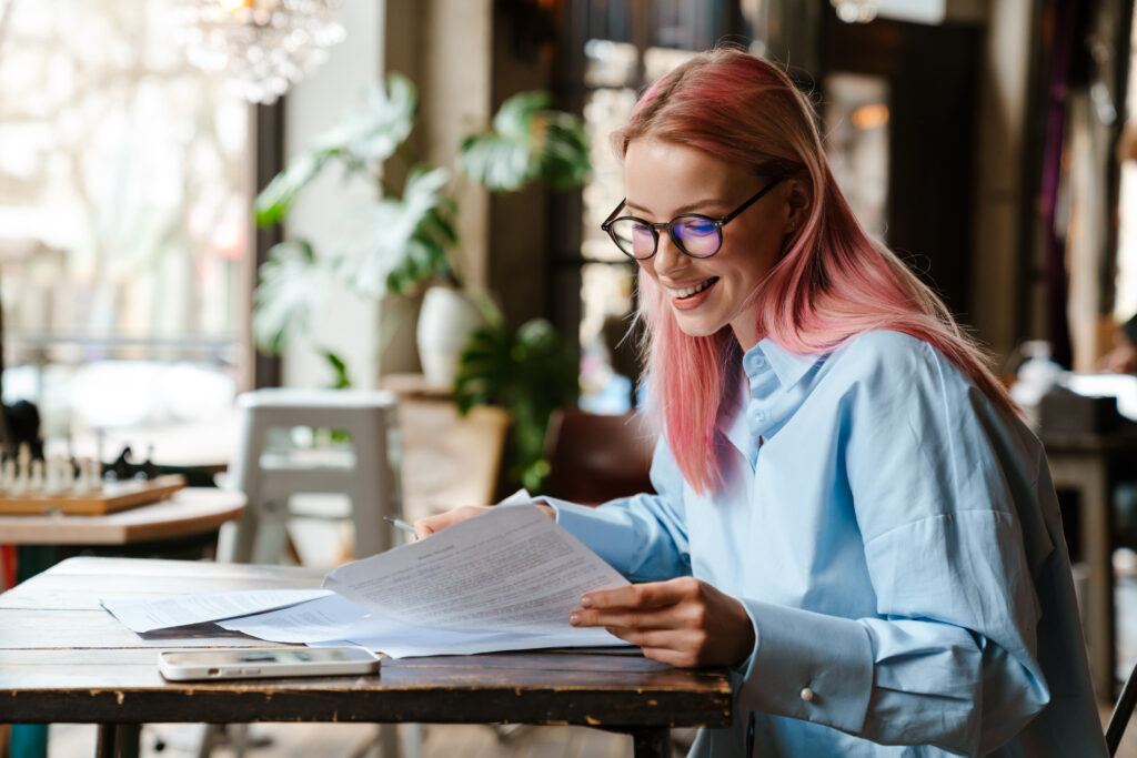Small business owner reviewing payroll options with employees in an office setting