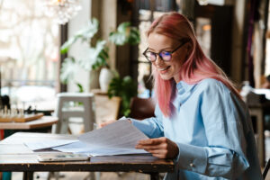 Small business owner reviewing payroll options with employees in an office setting